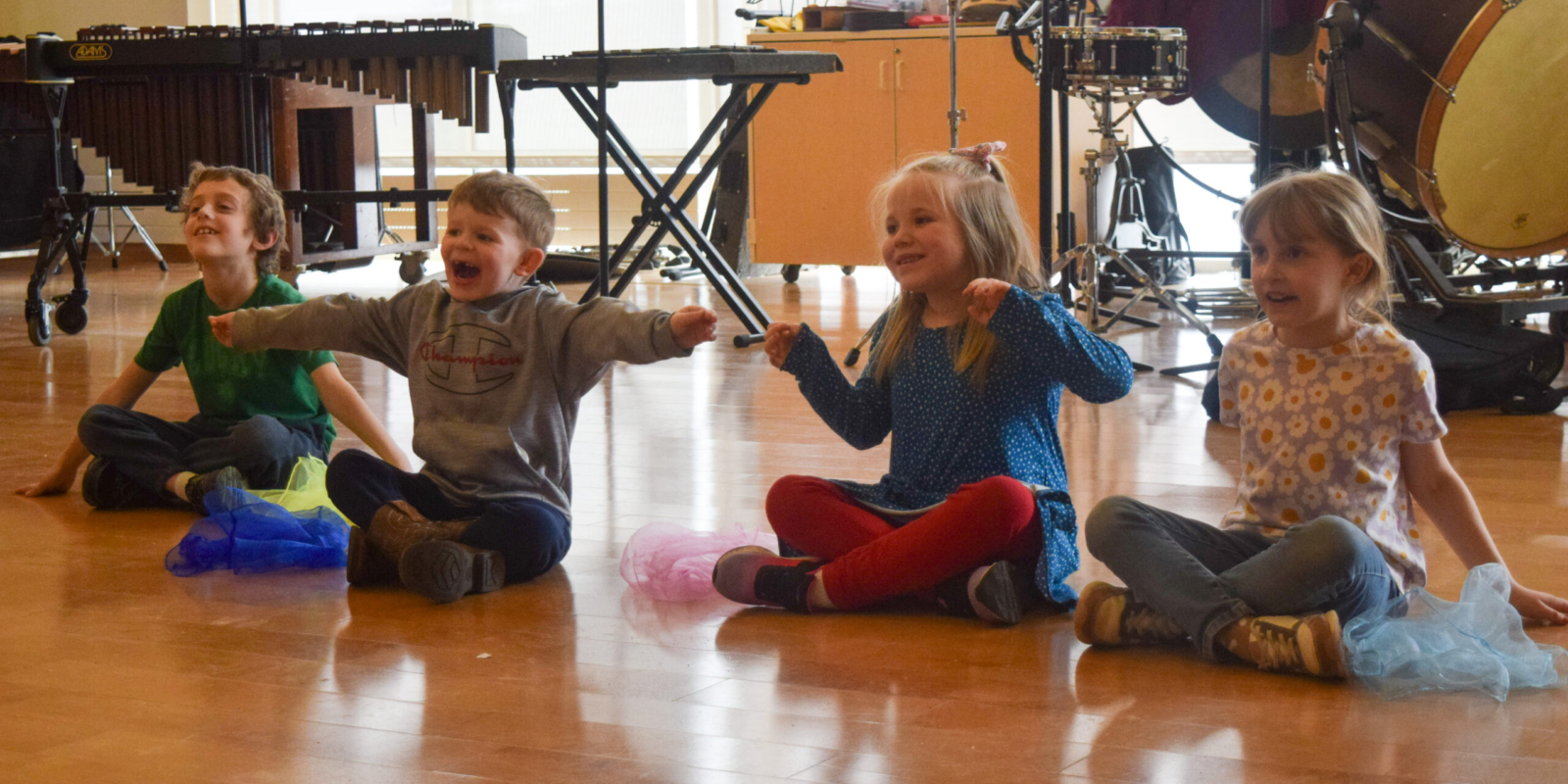 Students making sounds of wind & water with voice & body